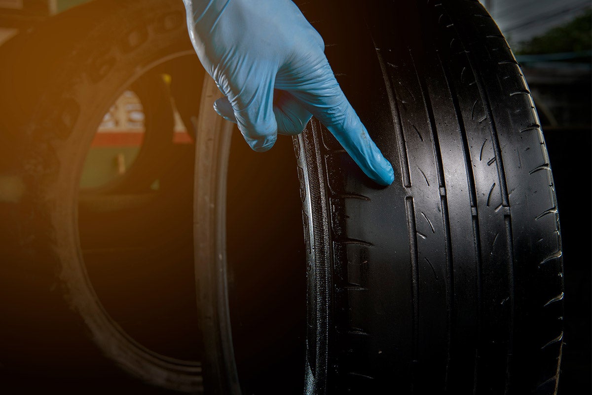 Various types of tire wear patterns and tread wear indicators